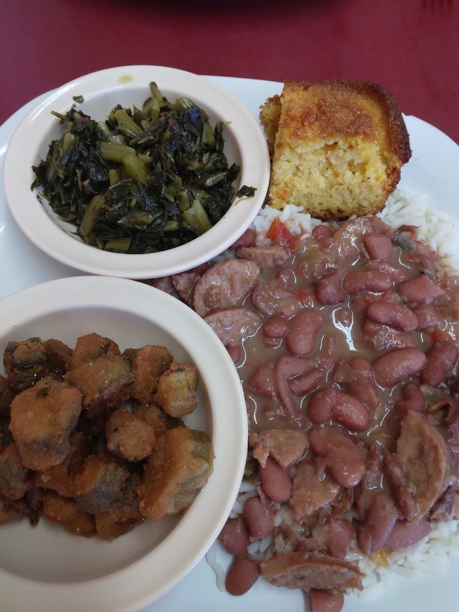 Red beans and sausage over rice with greens, fried okra and cornbread